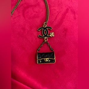 Authentic CHANEL CC mini purse gold and black necklace.